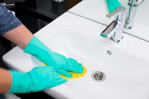 Professional carpet cleaner working safely in a home interior